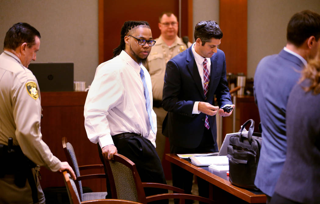 Ray Charles Brown, second from left, arrives in the courtroom after a break with one of his att ...