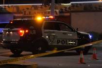 Las Vegas police investigate a body found in the intersection at North Lamb Boulevard and Stewa ...