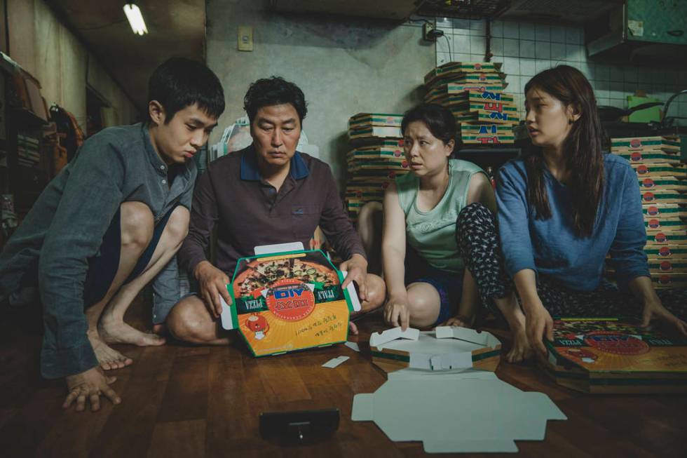 The Kim Family (Woo-sik Choi, Kang-ho Song, Hye-jin Jang, So-dam Park) in Parasite. (NEON CJ En ...