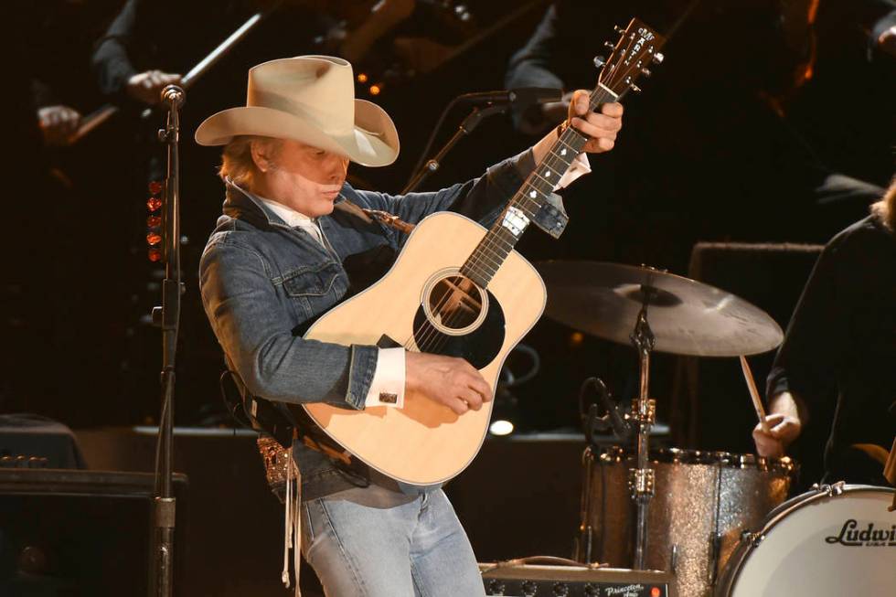 Dwight Yoakam performs "Seven Spanish Angels" at the 50th annual CMA Awards at the Br ...