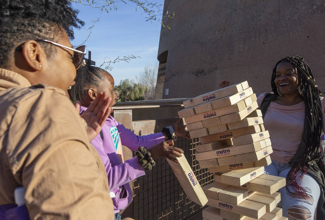 Taneesha Thomas, left, Cayden Townsend, center, and Clemmyesha Owens, right, react as their Jen ...