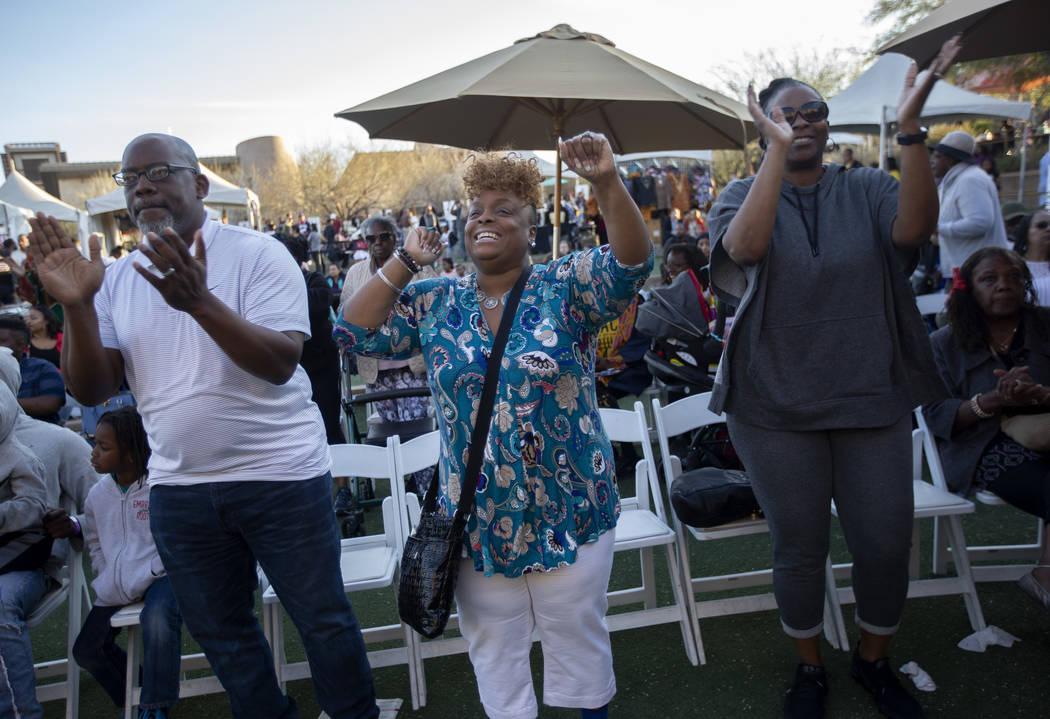 Pastor LeRoy Carr, left, Felicia Carr, center, and Jacki Hogans, right, dance to gospel music a ...