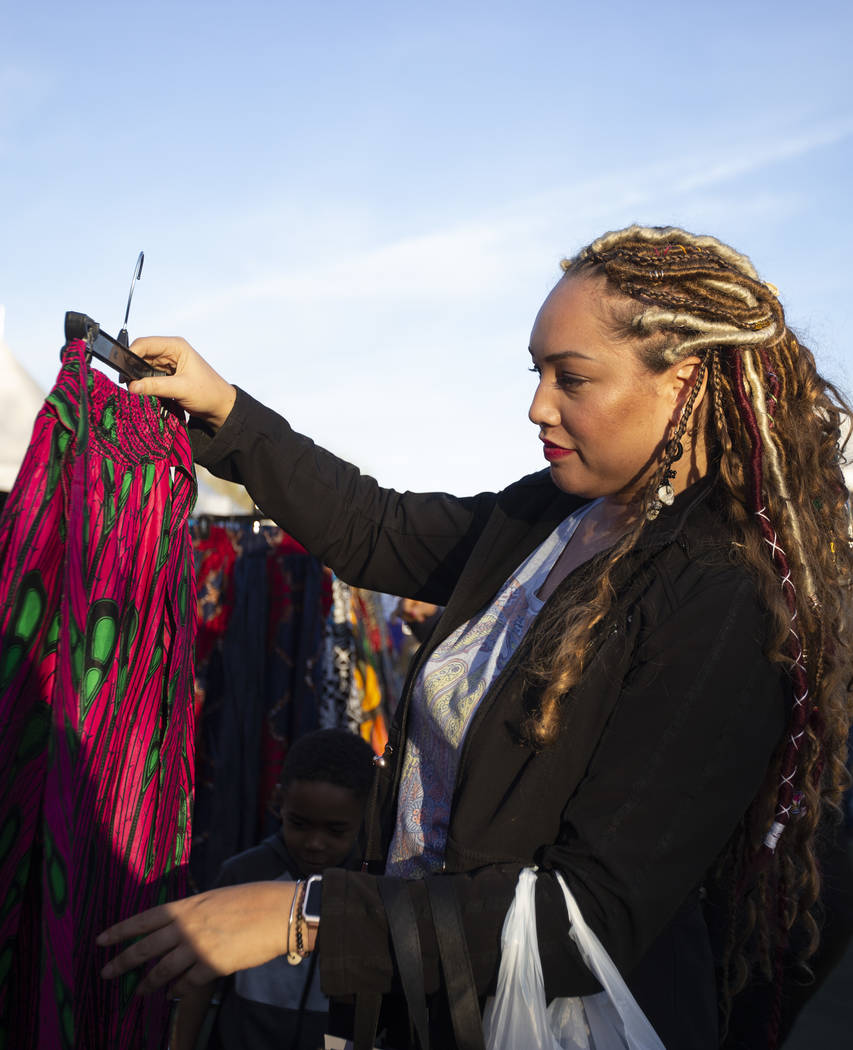 Keilani Williams of Las Vegas shops at HC Imports' tent at the Black History Month Festival at ...