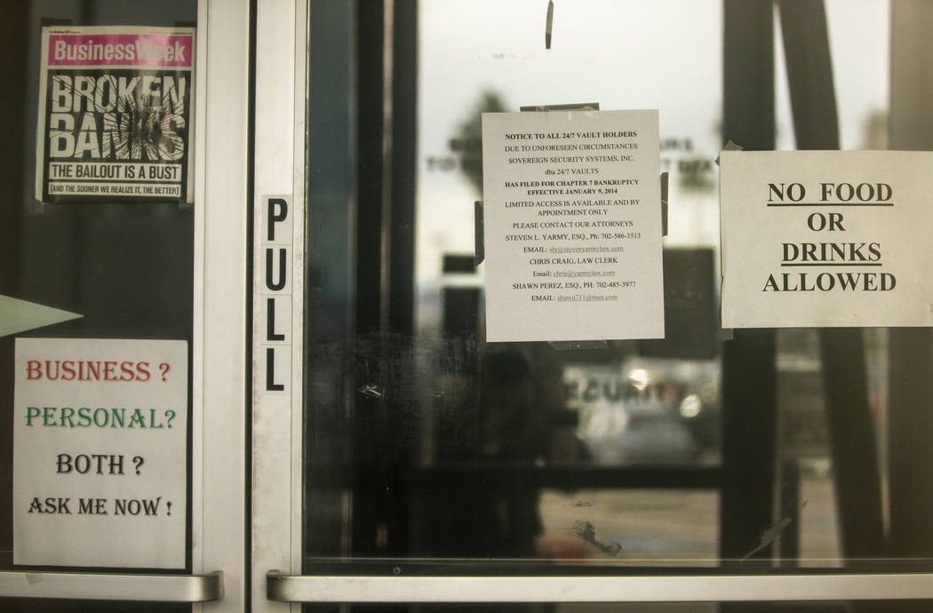 Interior door signs of 24/7 Private Vaults, which filed for bankruptcy and shut down in 2014, s ...