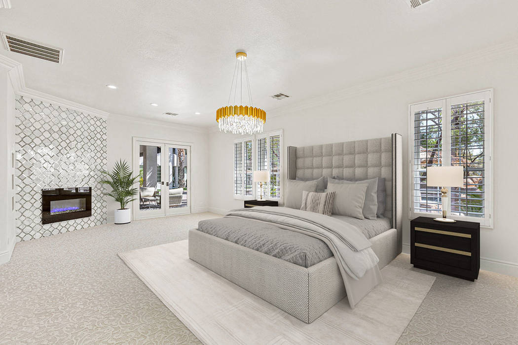 The master bedroom showcases a fireplace and custom chandelier, valued at more than $5,000. (Re ...