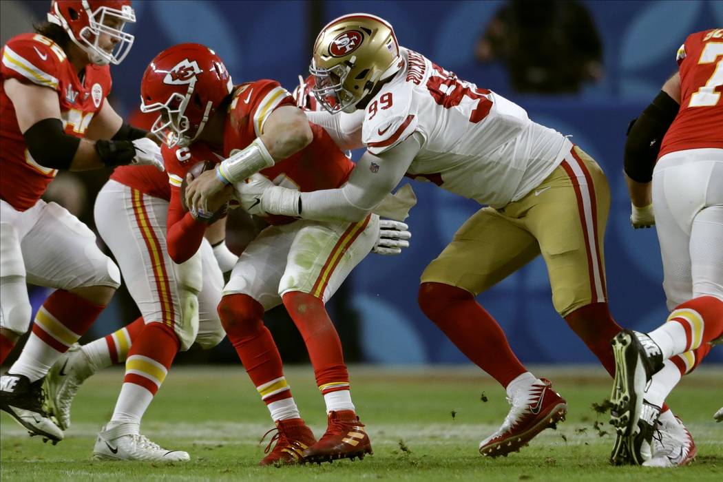 San Francisco 49ers' DeForest Buckner, right, sacks Kansas City Chiefs' quarterback Patrick Mah ...