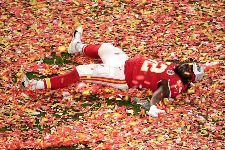 Kansas City Chiefs' Demone Harris (52) plays with the confetti, at the end of the NFL Super Bow ...