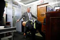 Lev Parnas, a Rudy Giuliani associate with ties to Ukraine, has his ankle bracelet checked by a ...