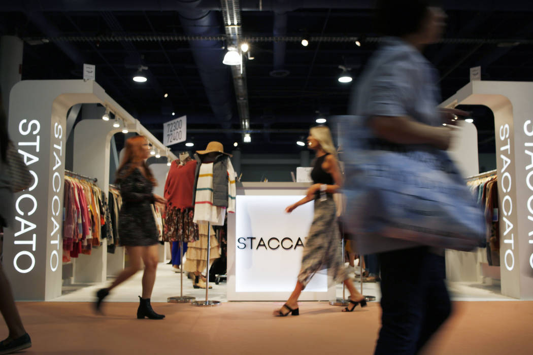 Attendees walk the show floor during the first day of the MAGIC trade show at the Las Vegas Con ...