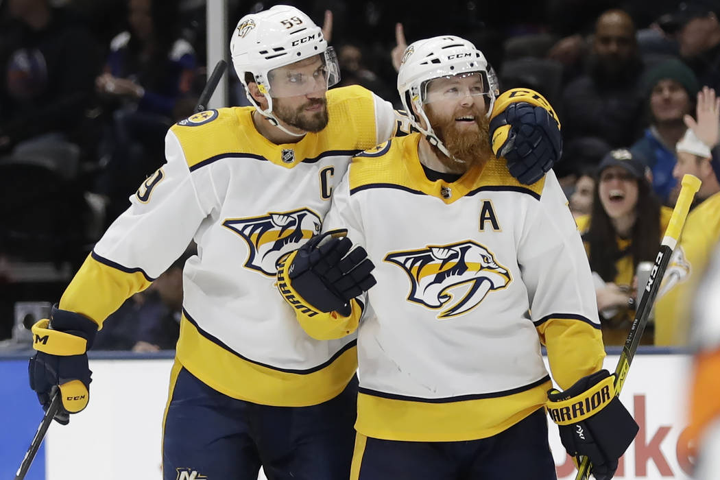 Nashville Predators' Roman Josi, left, celebrates with Ryan Ellis after scoring a goal during t ...
