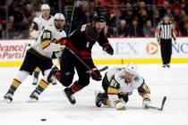 Carolina Hurricanes defenseman Joel Edmundson (6) and Vegas Golden Knights center Jonathan Marc ...