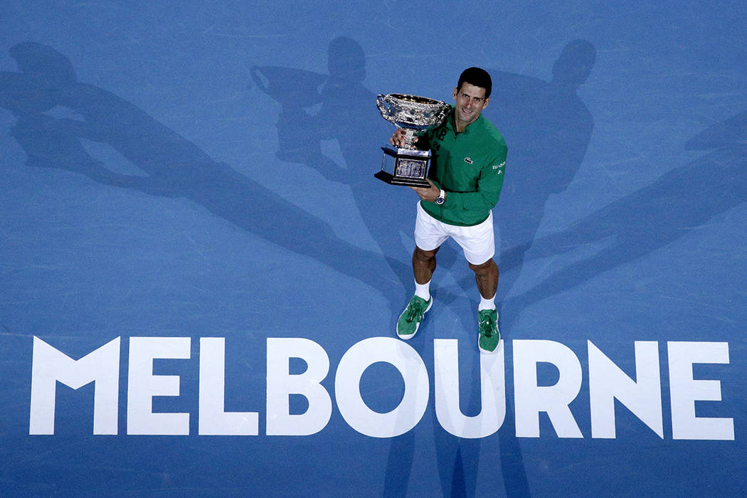 Serbia's Novak Djokovic holds the Norman Brookes Challenge Cup after defeating Austria's Domini ...