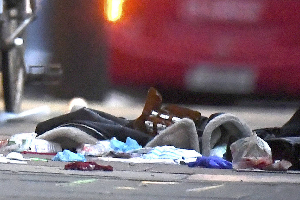 Items left on the pavement near the scene of a stabbing incident in Streatham High Road, London ...