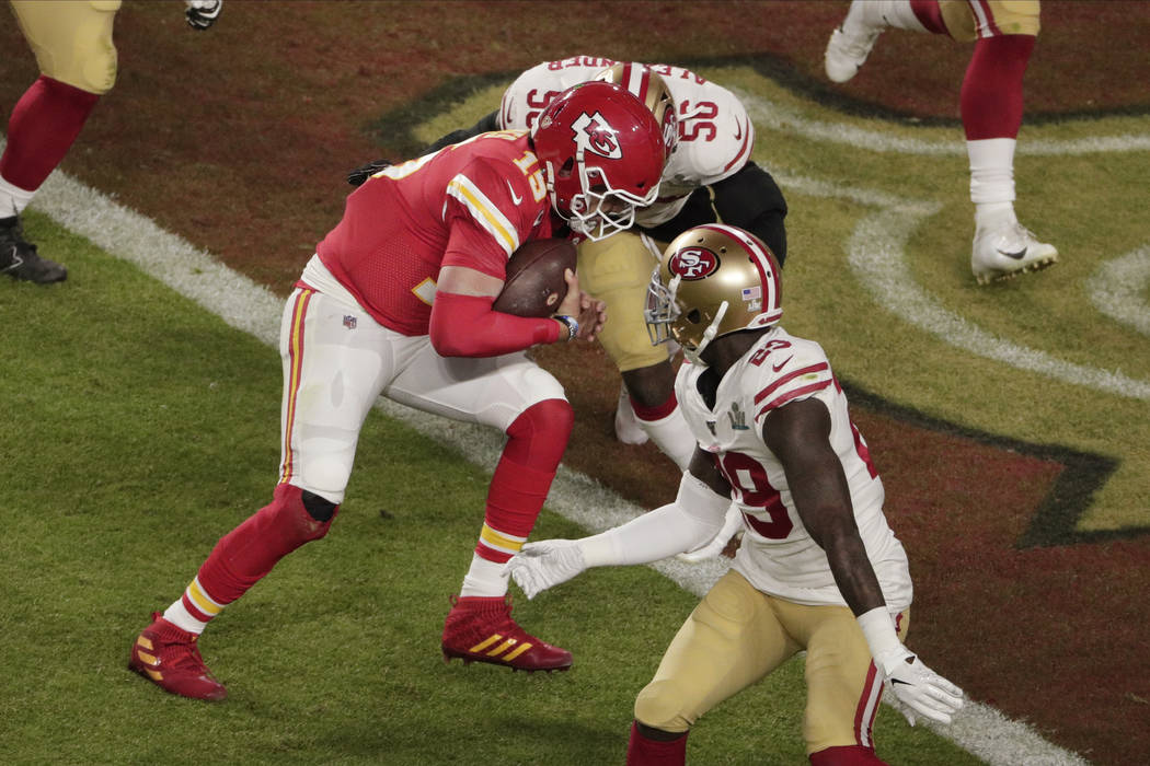 Kansas City Chiefs quarterback Patrick Mahomes (15) scores a touchdown as Kansas City Chiefs' B ...
