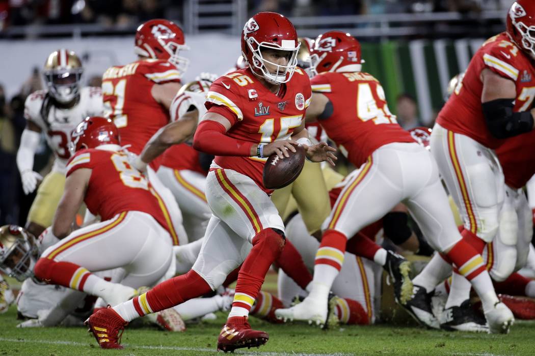 Kansas City Chiefs quarterback Patrick Mahomes (15) runs for a touchdown against the San Franci ...