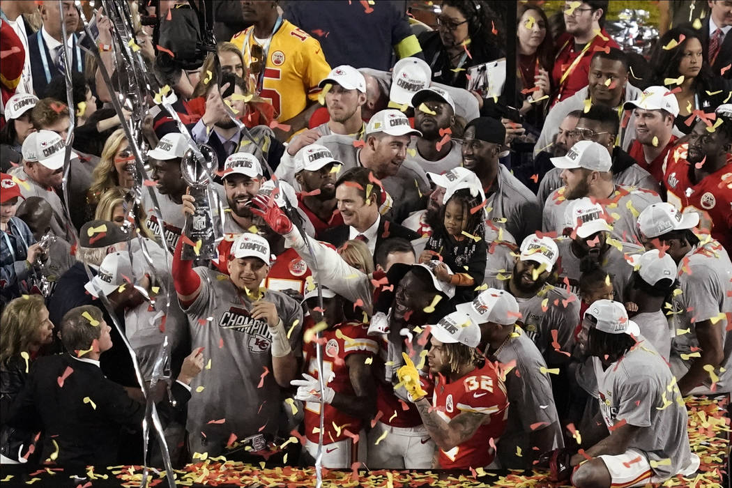 Kansas City Chiefs quarterback Patrick Mahomes holds the Vince Lombardi trophy, after his team ...