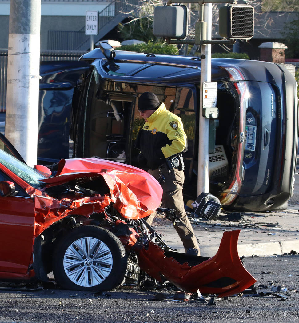 Metropolitan Police Department officers investigate a two-vehicle crash at South Jones Boulevar ...