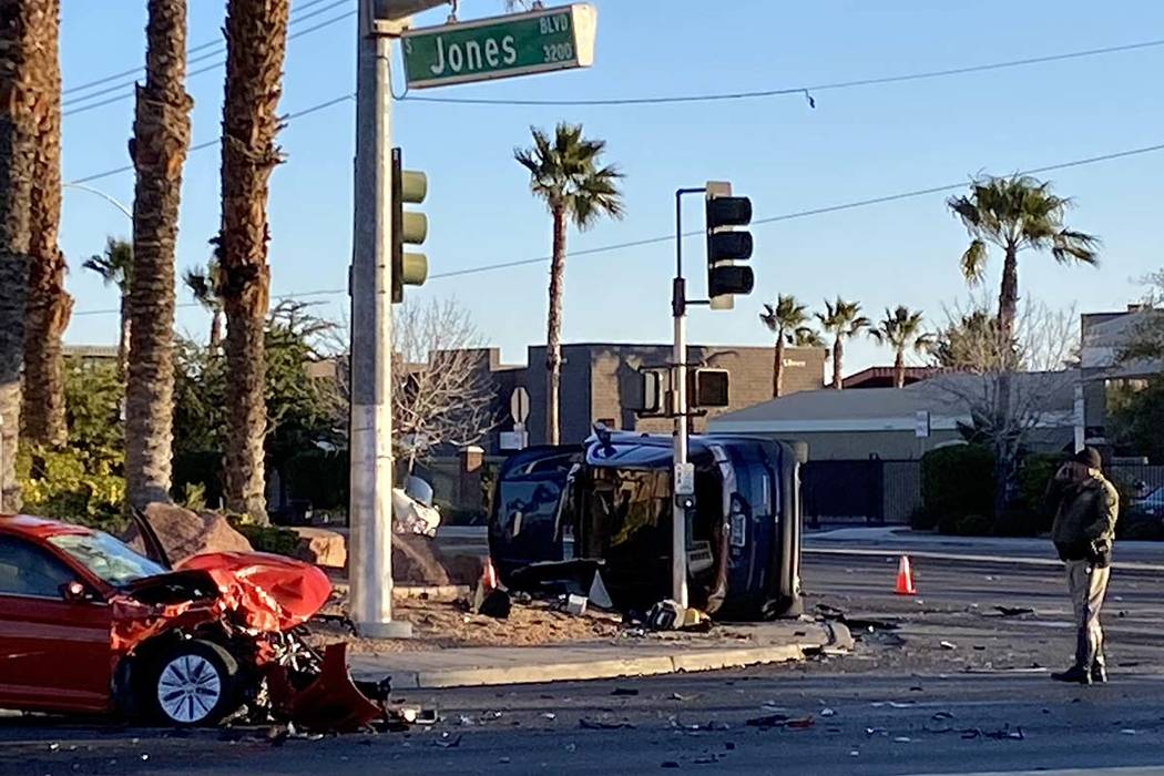 Metropolitan Police Department officers investigate a two-vehicle crash at South Jones Boulevar ...