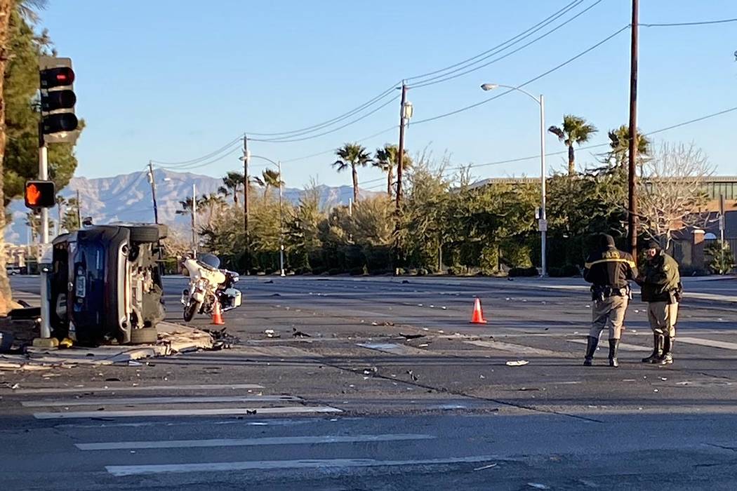 Metropolitan Police Department officers investigate a two-vehicle crash at South Jones Boulevar ...