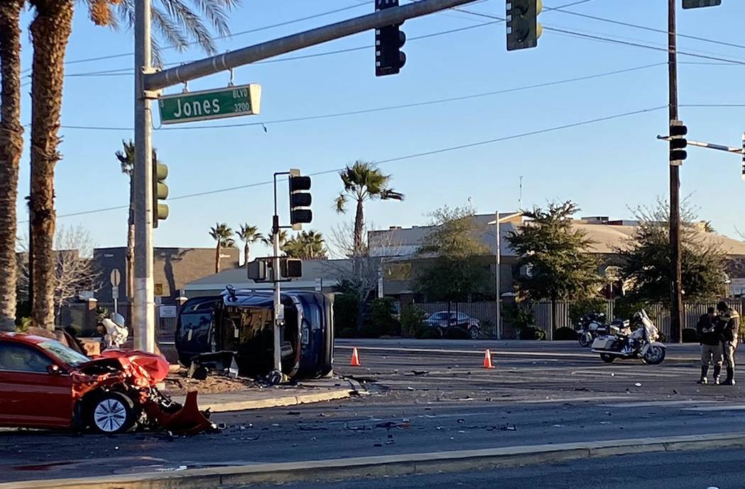 Metropolitan Police Department officers investigate a two-vehicle crash at South Jones Boulevar ...