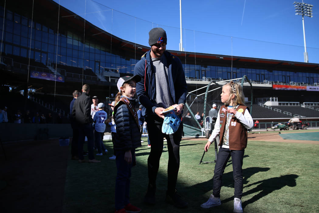 Chicago Cubs player Kris Bryant meets 7-year-olds Audrey Neal, left, and Audrey Shaw, of the Gi ...