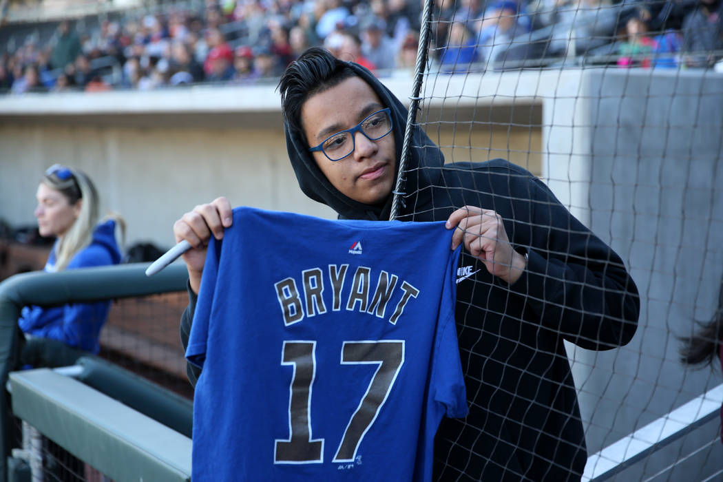 Marco Valdovinos, 15, of Las Vegas, waits for an autograph from Chicago Cubs player Kris Bryant ...