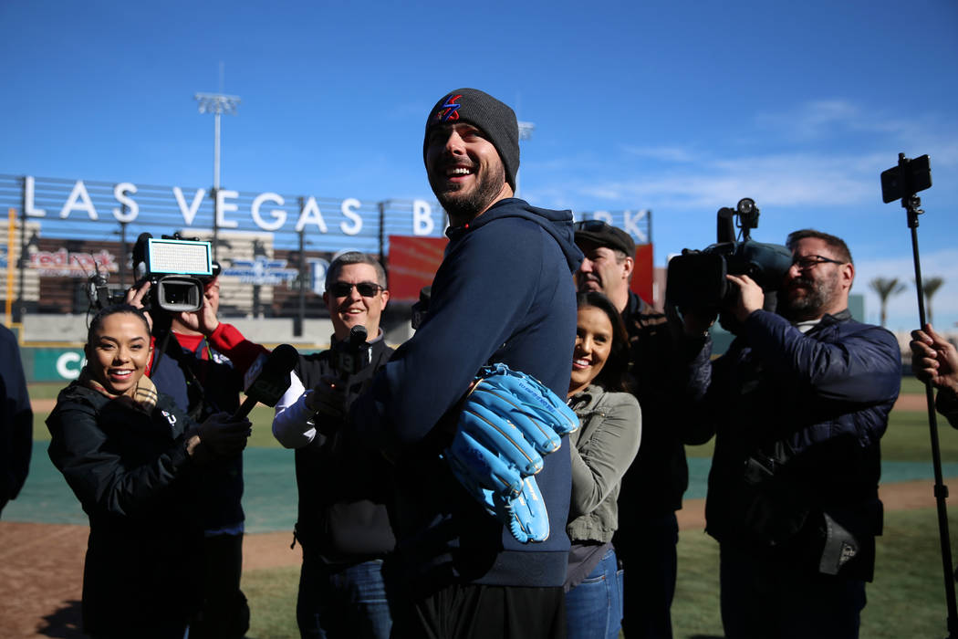 Chicago Cubs player Kris Bryant holds is interviewed during a live batting practice event at La ...