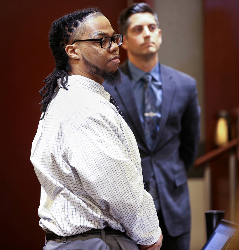 Ray Charles Brown, right, stands as the jury arrives in the courtroom with one of his attorneys ...