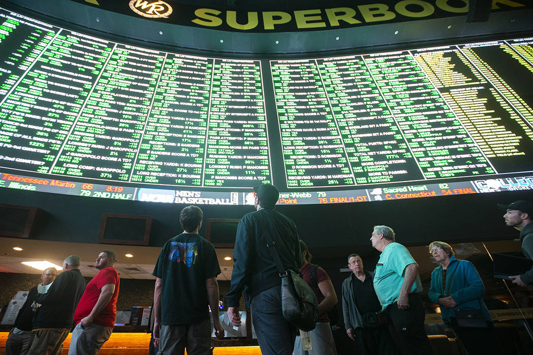 Bettors wait in line at Westgate Sportsbook as Super Bowl prop bets are listed on Thursday, Jan ...