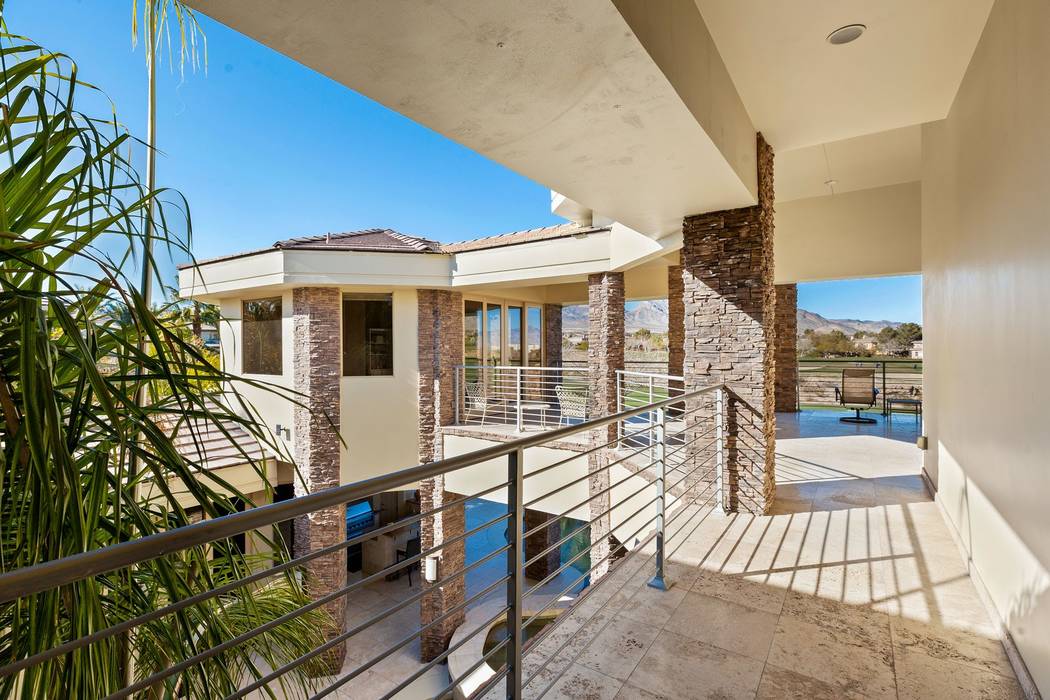 A second-story balcony looks over the backyard. (Ivan Sher Group)