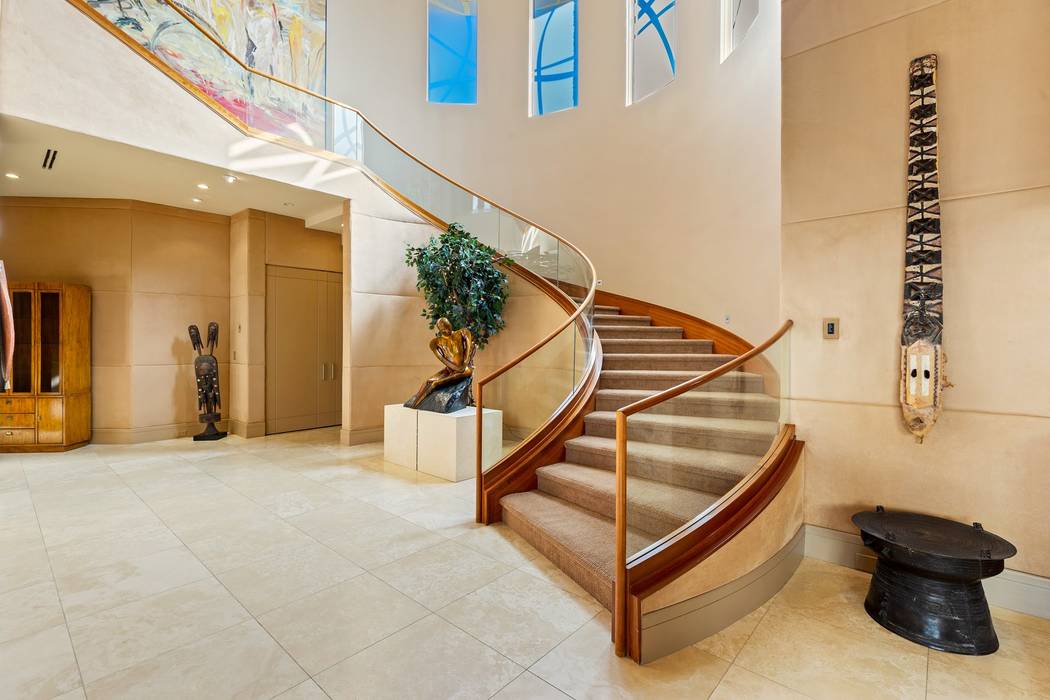 The three-level home has a wide staircase. (Ivan Sher Group)