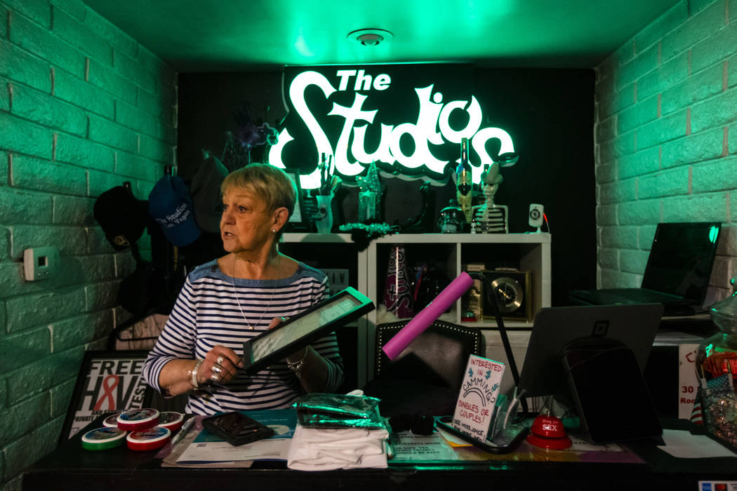 Joyce Judge holds her business license at The Studios, a fluid lifestyles learning center, in L ...