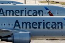 A pair of American Airlines jets (AP Photo/Wilfredo Lee)