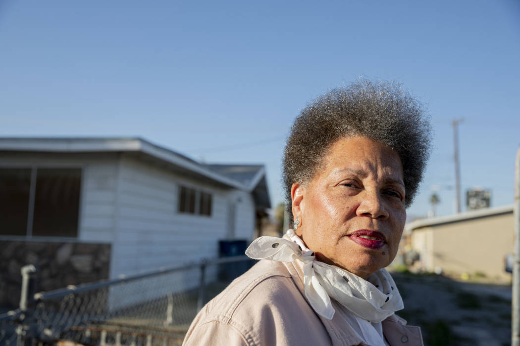 Jackie Brantley stands in front of the home she grew up in located only two blocks away from Ja ...