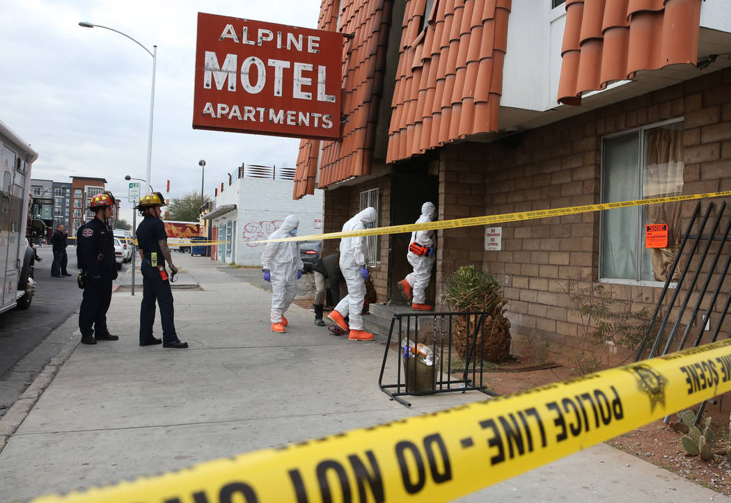 Las Vegas Fire Department investigators enter the Alpine Motel Apartments on Dec. 23, 2019, as ...