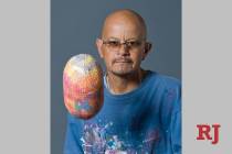 A memorial for local artist Alex Huerta, shown with egg art in 2011, will be part of First Frid ...
