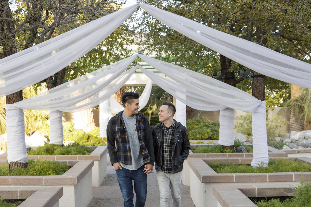 Las Vegas locals Sam Cruz, left, and Jeff Gaglione walk down the aisle together in their future ...
