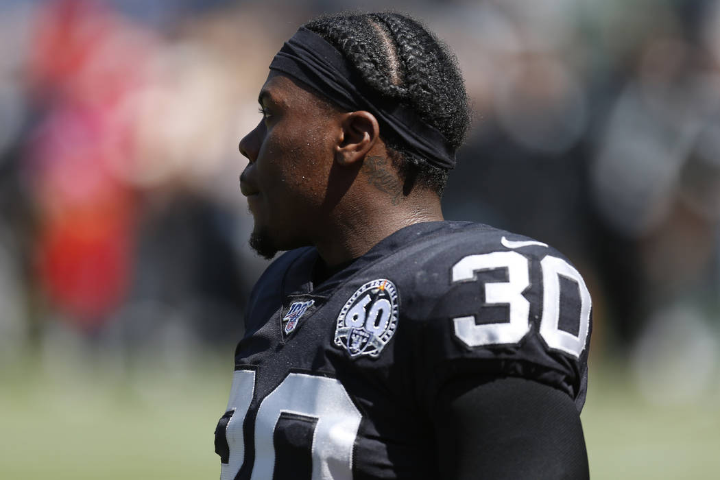 Oakland Raiders running back Jalen Richard warms up before an NFL football game against the Kan ...