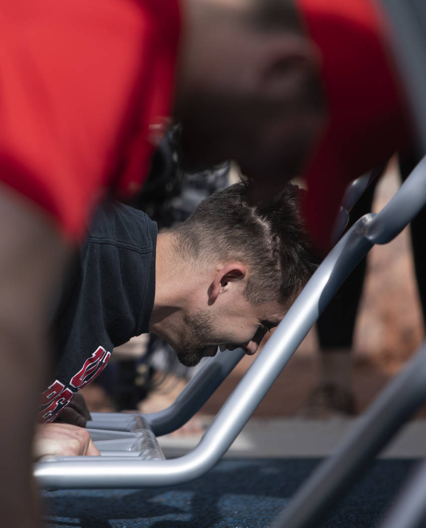 Former UNLV athlete Chase Skenandore does pushups to demonstrate the new outdoor Fitness Court ...