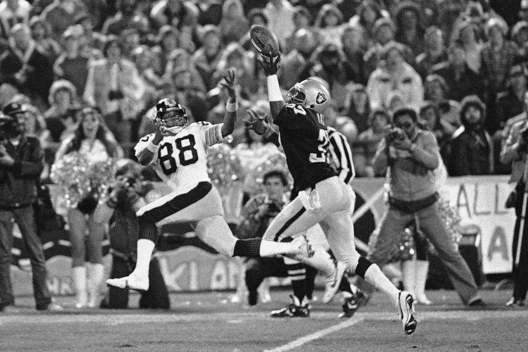 Oakland Raiders back Lester Hayes deflects a pass intended for Pittsburg Steelers wide receiver ...