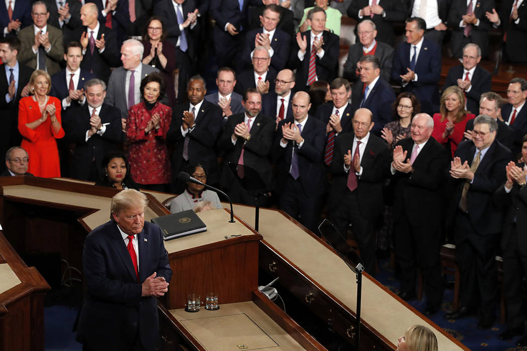 President Donald Trump walks from the podium after he delivered his State of the Union address ...