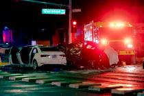 Police and fire crews investigate a fatal crash, Dec. 26, 2019, at the intersection of West Des ...