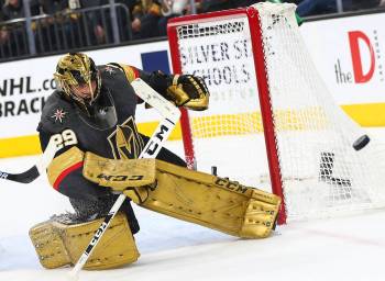 Golden Knights goaltender Marc-Andre Fleury (29) blocks a shot from the Arizona Coyotes during ...