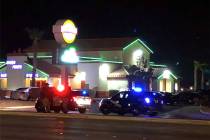Police respond to the scene of a fatal crash along Las Vegas Boulevard South, near the South Po ...