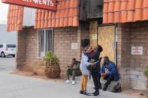 Displaced Alpine Motel Apartments tenants and employees mourn on Jan. 21, 2020, at the apartmen ...