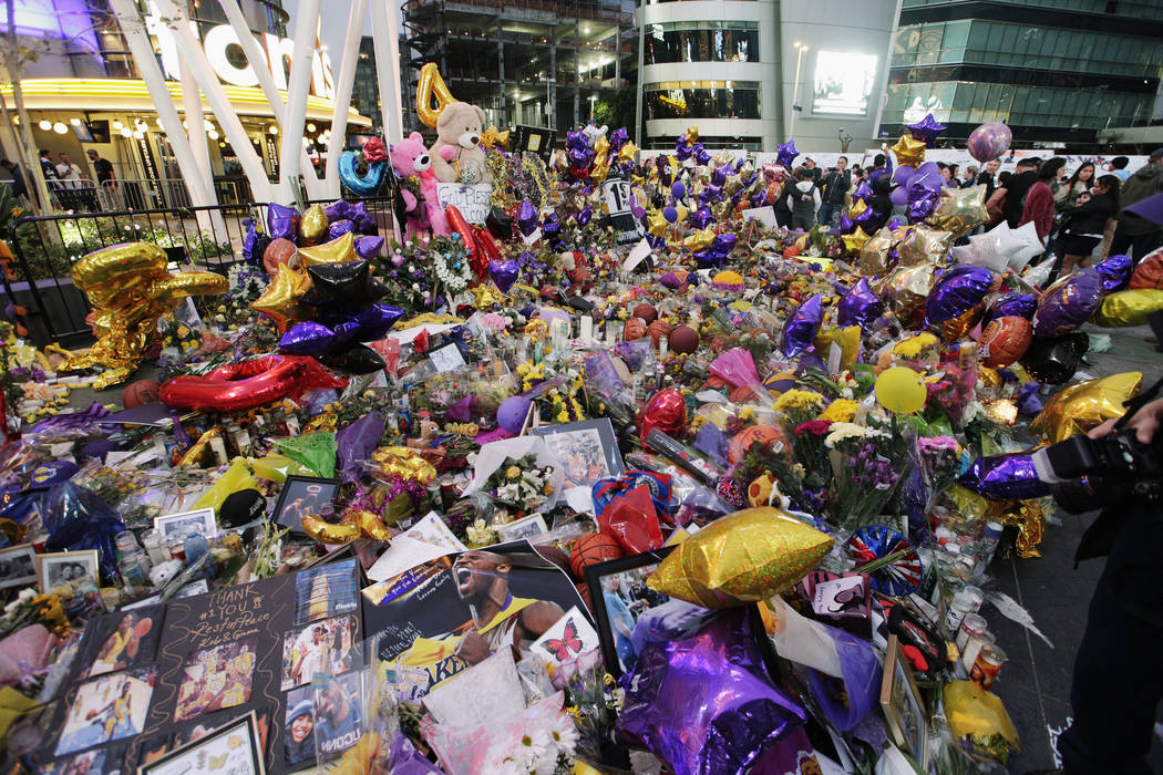 Fans gather at a memorial for the late Kobe Bryant in front of Staples Center in Los Angeles, S ...
