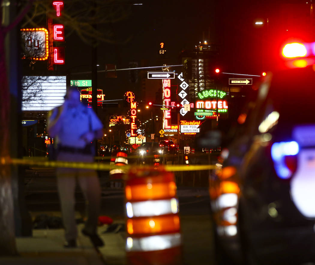 Las Vegas police officers investigate the scene of a shooting on Fremont Street between 14th an ...