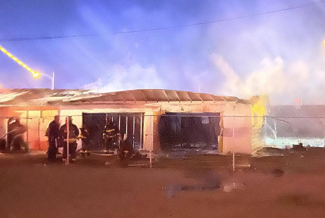 North Las Vegas firefighters battle a blaze at 2511 McCarran St. about 5 a.m. Friday, Feb. 7, 2 ...