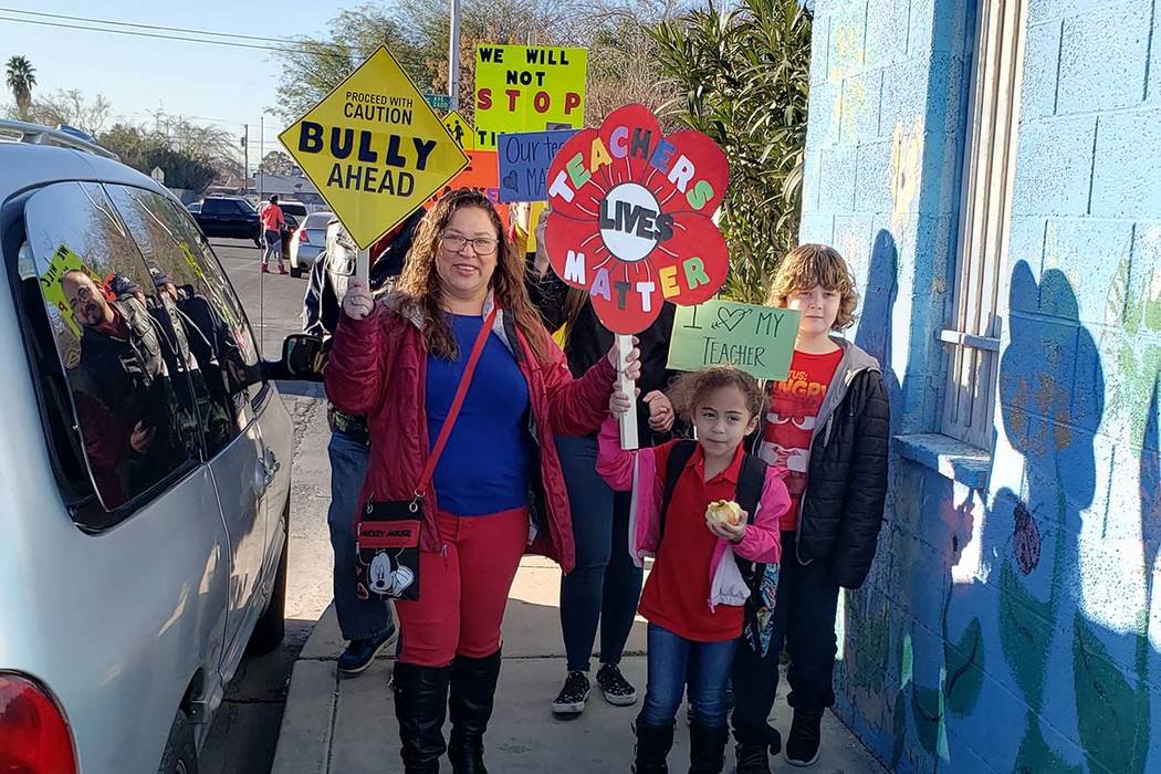 Parent Shuuanndy Alvarez, left, at a rally at Walter Bracken STEAM Academy on Friday, Feb. 7, 2 ...