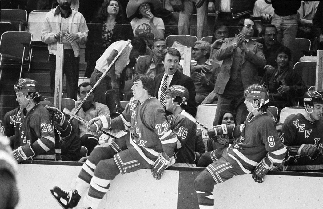 New York Rangers coach Herb Brooks yells at the buzzer as his team leaps off the bench with a 4 ...